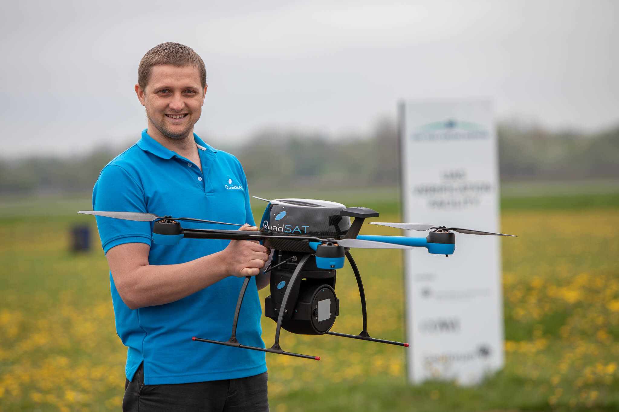Vitalie holding drone for demonstration